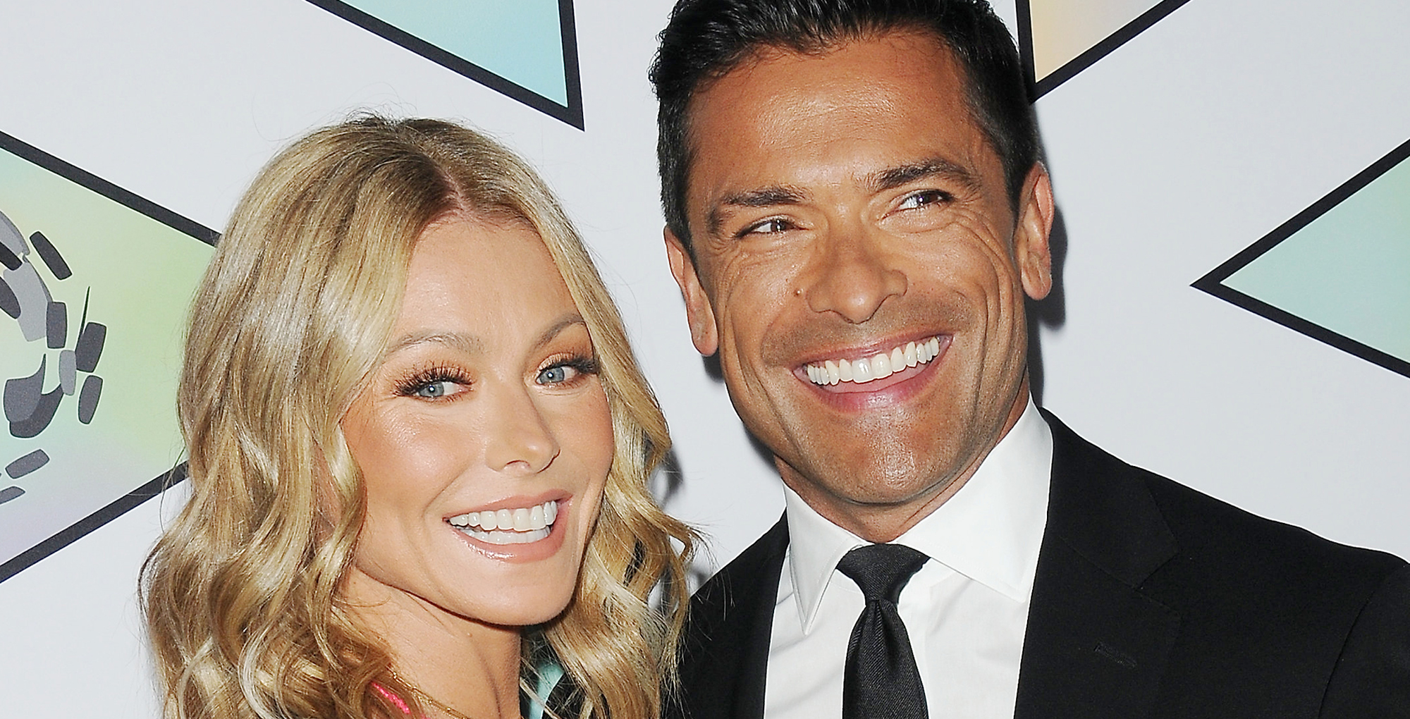 kelly ripa and mark consuelos in glamour shot smiling