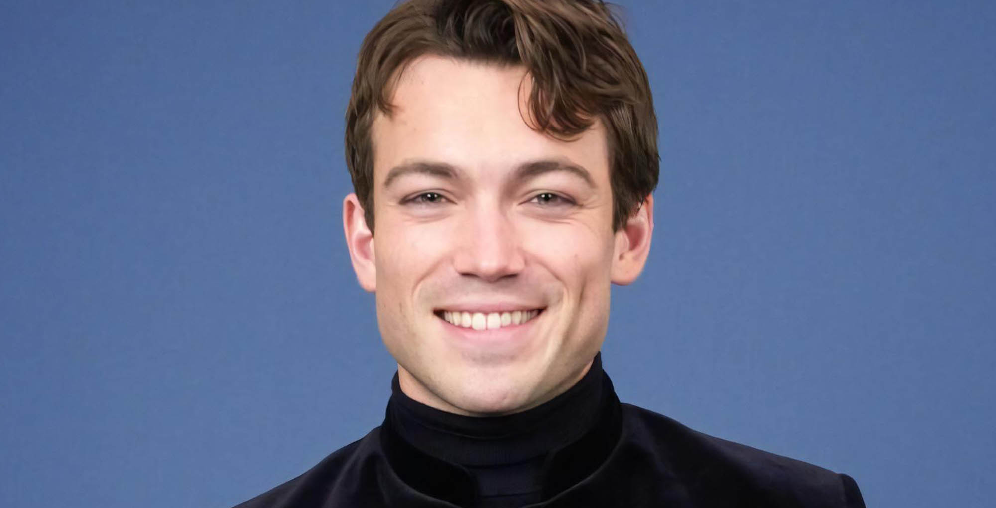 the young and the restless rory gibson wearing black against a blue background.