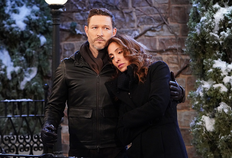 daniel romalotti hugs lily winters in front of a snowy tree