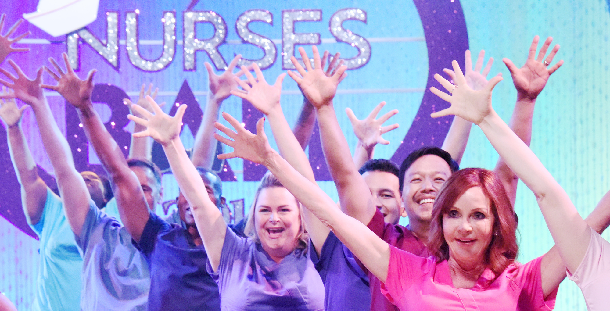 nurses in colorful scrubs at previous nurses ball as general hospital nurses ball to return