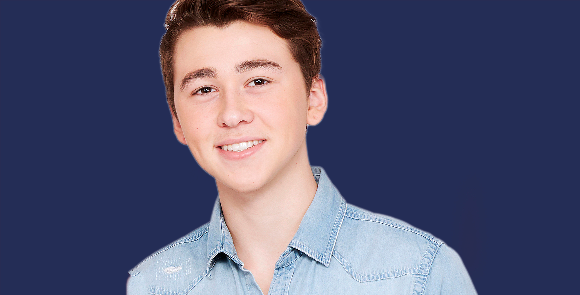 garren stitt general hospital wearing blue against a dark blue background.
