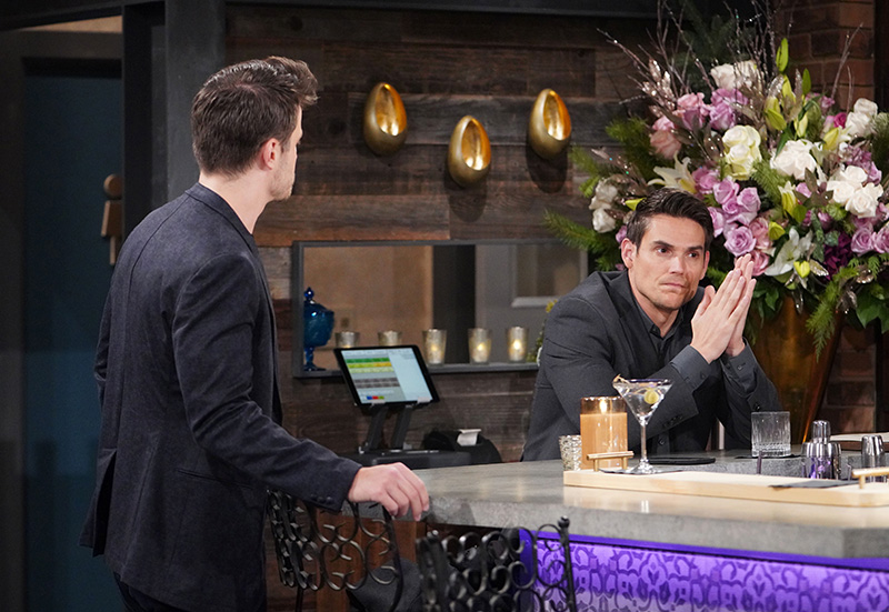 adam newman looks annoyed sitting at the bar at society as kyle abbott confronts him