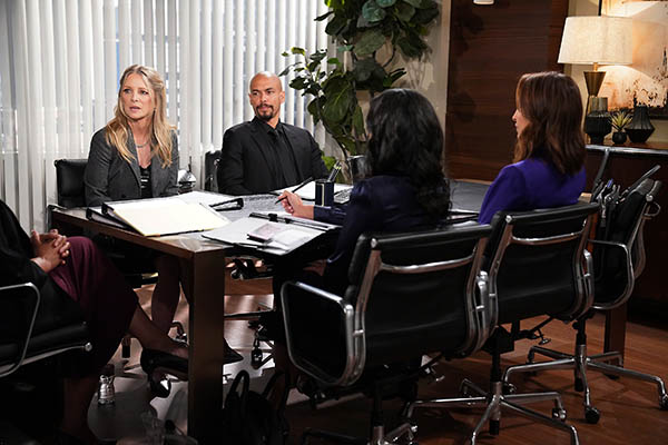 christine, devon, lily, and amanda sit at the arbitration table.