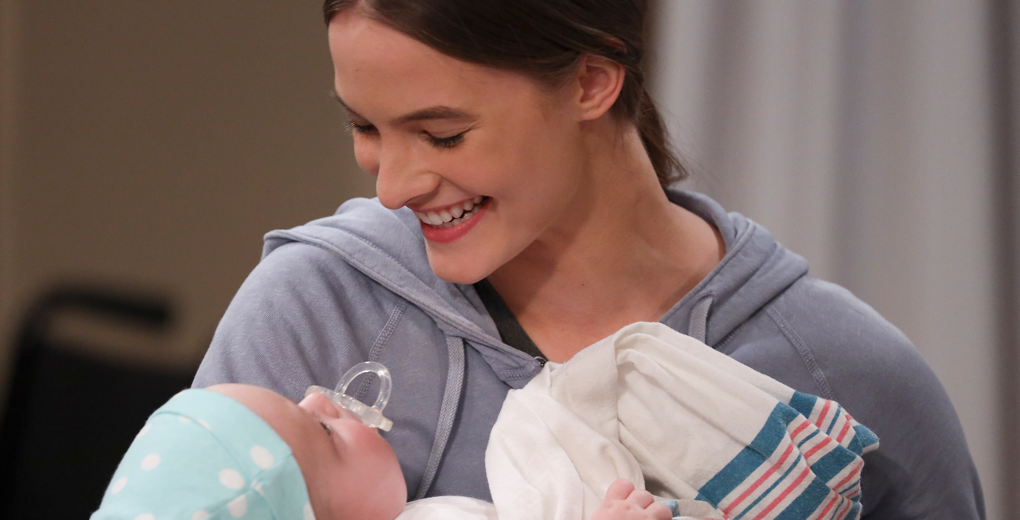 esme prince with ace in the hallway by the elevator at general hospital