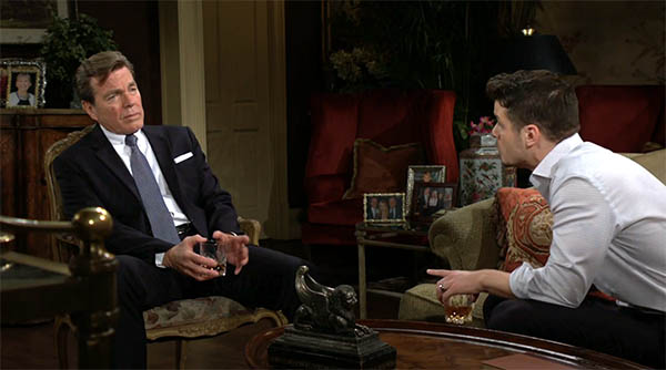 jack and kyle talk in the abbott living room.