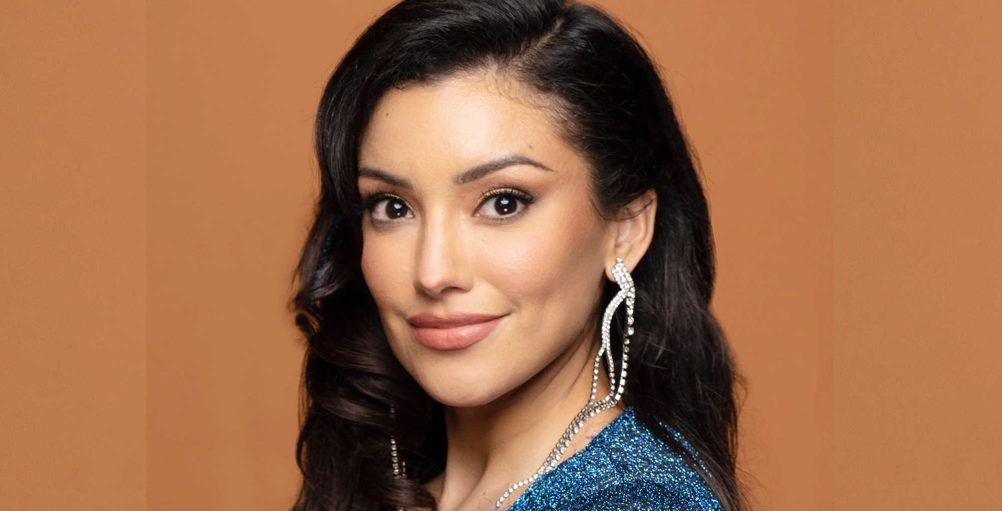 young and the restless star zuleyka silver against an orange background.