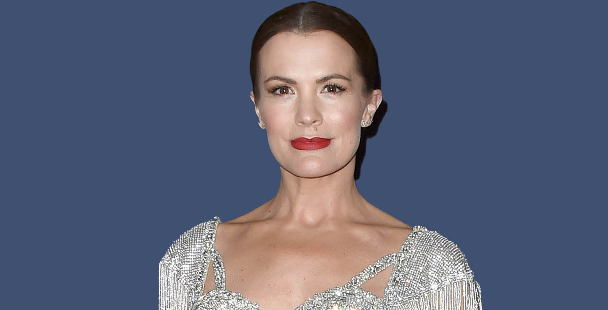 melissa claire egan the young and the restless wearing a sparkly silver top.