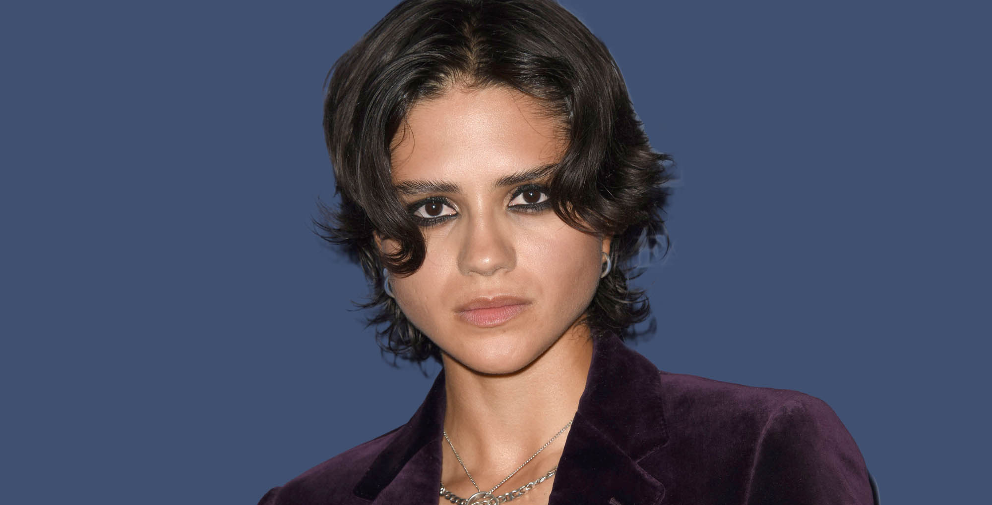 young and the restless alum sasha calle against a blue background.