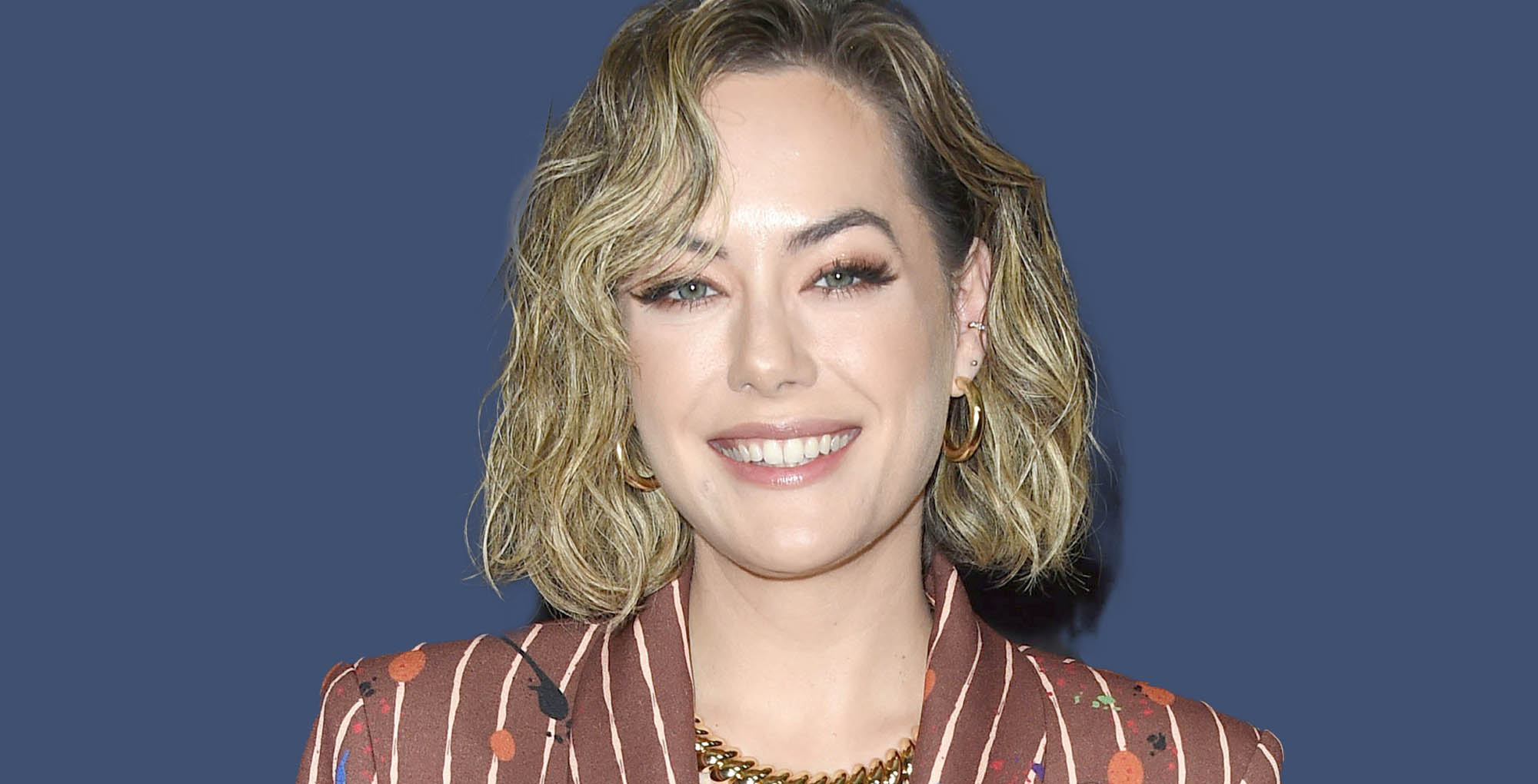 annika noelle from the bold and the beautiful on a blue background.