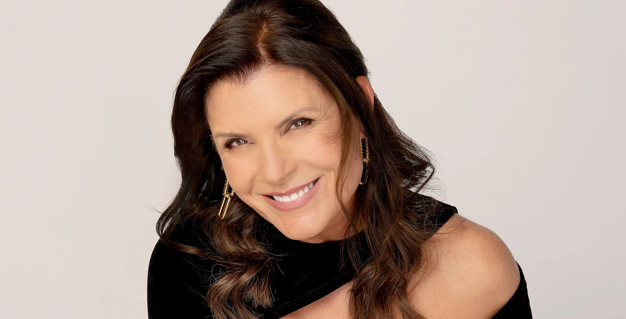 The Bold and the Beautiful star Kimberlin Brown; with the Soap Hub logo.