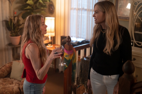 L-R: LeAnn Rimes as Dixie Bennings. She's holding a wine glass as she speaks to Jessica Capshaw as Blythe Hart. 9-1-1: Nashville.